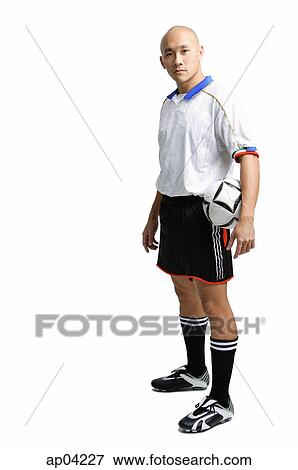 Young man wearing soccer uniform View Large Photo Image Stock Photo - Young man wearing soccer uniform. Fotosearch