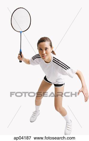 Young woman holding badminton racket View Large Photo Image Stock Photo - Young woman holding badminton racket. Fotosearch