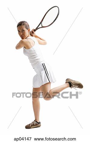 Young woman holding tennis racket View Large Photo Image Stock Photo - Young woman holding tennis racket . Fotosearch