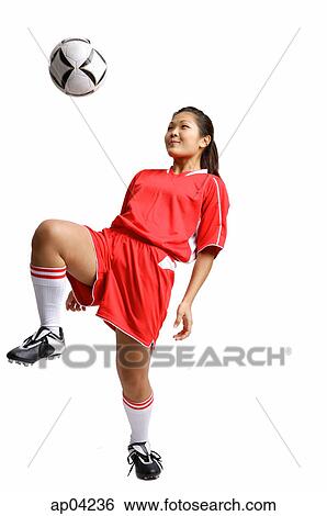 Young woman in soccer uniform, kneeing soccer ball View Large Photo Image Stock Photograph - Young woman in soccer uniform, kneeing soccer ball. Fotosearch