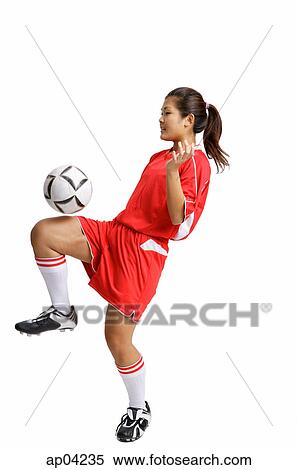 Young woman in soccer uniform, balancing ball on knee View Large Photo Image Stock Photography - Young woman in soccer uniform, balancing ball on knee. Fotosearch