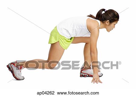 Young woman in starting position, side view View Large Photo Image Stock Image - Young woman in starting position, side view . Fotosearch
