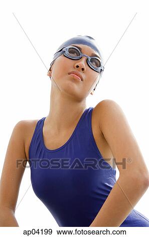 Young woman in swimming cap and goggles View Large Photo Image Stock Photo - Young woman in swimming cap and goggles. Fotosearch