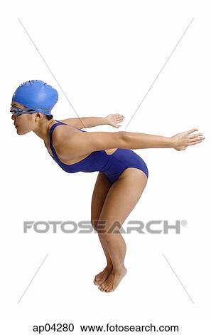 Young woman in swimwear preparing to dive, arms outstretched behind her View Large Photo Image Stock Image - Young woman in swimwear preparing to dive, arms outstretched behind her . Fotosearch