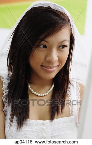 Young woman in white dress and veil, head shot View Large Photo Image Stock Photograph - Young woman in white dress and veil, head shot. Fotosearch