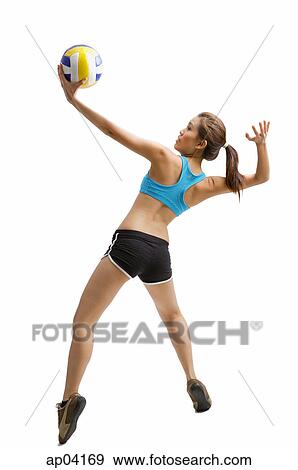 Young woman jumping, preparing to hit volleyball View Large Photo Image Stock Photo - Young woman jumping, preparing to hit volleyball . Fotosearch