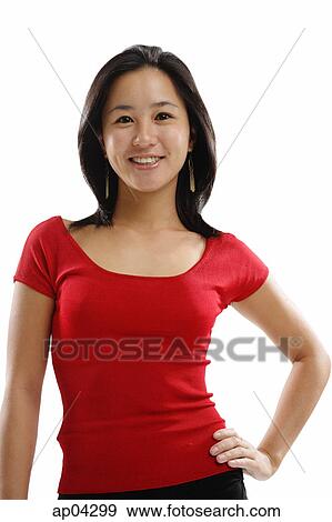 Young woman looking at camera, hand on hip View Large Photo Image Stock Photo - Young woman looking at camera, hand on hip . Fotosearch