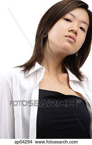 Picture - Young woman looking at camera, head shot . Fotosearch