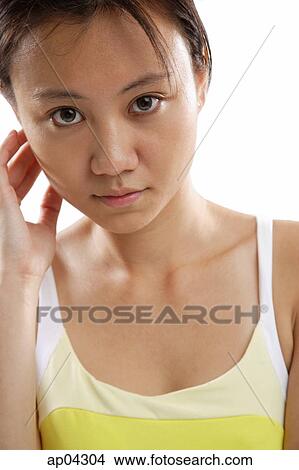 Picture - Young woman looking at camera . Fotosearch