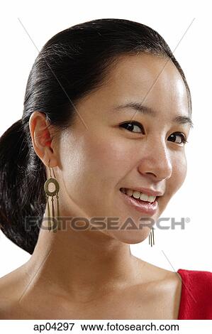 Young woman looking at camera, sideways glance View Large Photo Image Stock Photo - Young woman looking at camera, sideways glance. Fotosearch