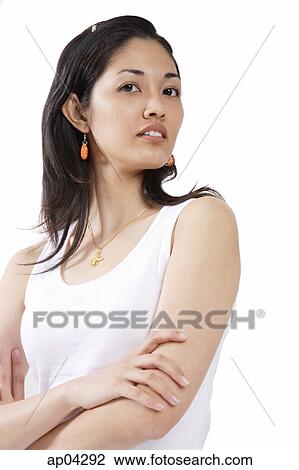 Young woman looking away, arms crossed View Large Photo Image Stock Image - Young woman looking away, arms crossed. Fotosearch