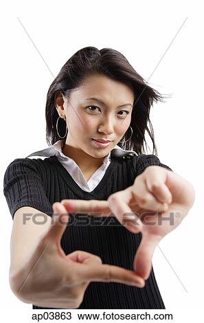 Young woman making hand sign View Large Photo Image Stock Image - Young woman making hand sign . Fotosearch