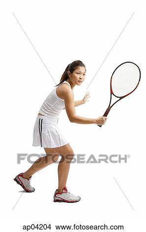 Picture - Young woman playing tennis. Fotosearch