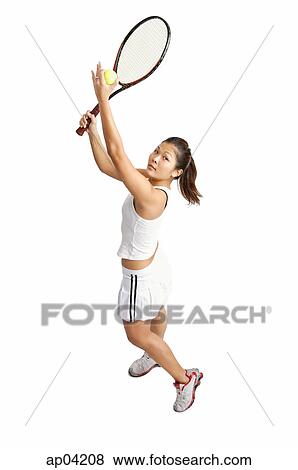Young woman serving tennis ball View Large Photo Image Stock Photo - Young woman serving tennis ball. Fotosearch