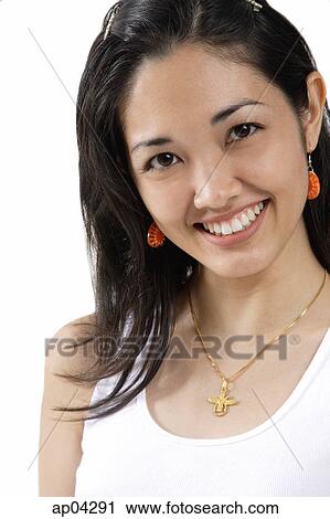 Young woman smiling at camera, head shot View Large Photo Image Stock Image - Young woman smiling at camera, head shot. Fotosearch