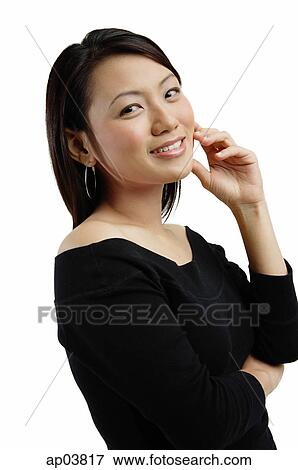 Young woman smiling, looking at camera View Large Photo Image Stock Photo - Young woman smiling, looking at camera . Fotosearch