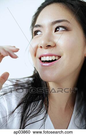 Stock Image - Young woman smiling. Fotosearch