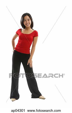 Young woman standing and smiling View Large Photo Image Stock Image - Young woman standing and smiling. Fotosearch