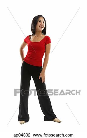 Young woman standing and smiling View Large Photo Image Stock Image - Young woman standing and smiling . Fotosearch
