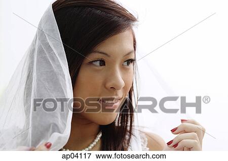 Young woman wearing veil, head shot View Large Photo Image Stock Photo - Young woman wearing veil, head shot . Fotosearch