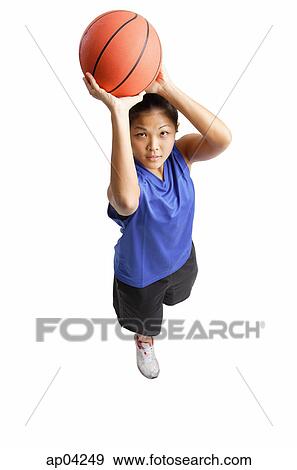 Young woman with basketball, aiming for a shoot View Large Photo Image Stock Photo - Young woman with basketball, aiming for a shoot . Fotosearch