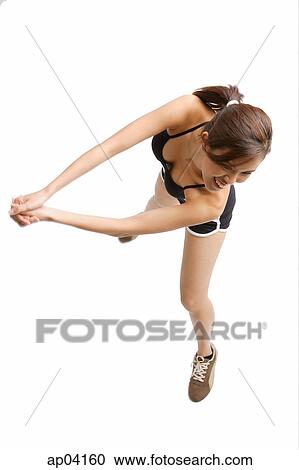 Young woman with hands clasped, preparing to hit ball View Large Photo Image Stock Image - Young woman with hands clasped, preparing to hit ball. Fotosearch