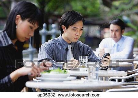 Business people at outdoor café View Large Photo Image Stock Image - Business people at outdoor café. Fotosearch