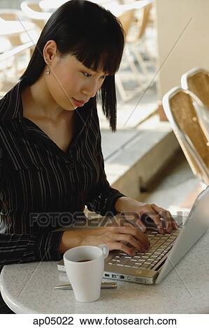Businesswoman in cafe with laptop View Large Photo Image Stock Image - Businesswoman in cafe with laptop. Fotosearch