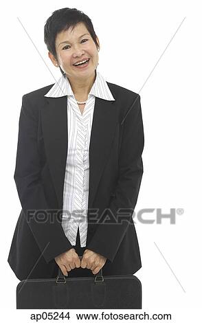 Picture - Businesswoman with briefcase, smiling at camera. Fotosearch