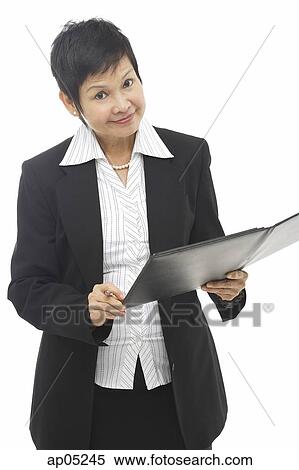 Businesswoman with folder, looking at camera View Large Photo Image Stock Photography - Businesswoman with folder, looking at camera. Fotosearch