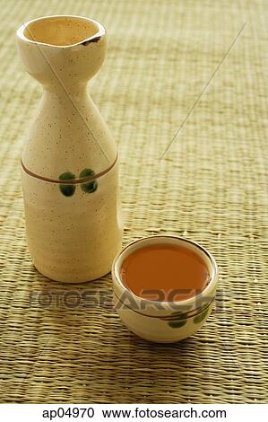 Ceramic bottle and cup with tea View Large Photo Image Stock Image - Ceramic bottle and cup with tea. Fotosearch