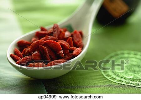 Close-up of dried fruit in ceramic spoon View Large Photo Image Stock Photo - Close-up of dried fruit in ceramic spoon. Fotosearch