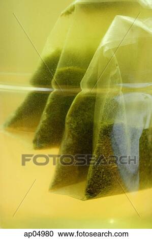Stock Image - Close-up of Teabags in glass. Fotosearch