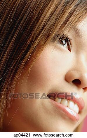 Close-up of woman's face, looking away View Large Photo Image Stock Image - Close-up of woman's face, looking away. Fotosearch
