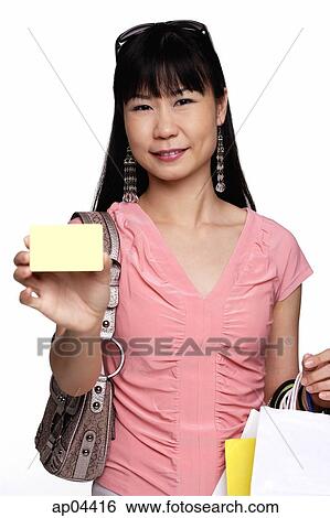 Female shopper holding shopping bags and credit card View Large Photo Image Stock Photograph - Female shopper holding shopping bags and credit card. Fotosearch