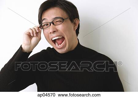 Man in black turtleneck, adjusting glasses, mouth open View Large Photo Image Stock Image - Man in black turtleneck, adjusting glasses, mouth open. Fotosearch