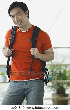 Man in red T shirt and jeans View Large Photo Image Stock Photo - Man in red T shirt and jeans. Fotosearch