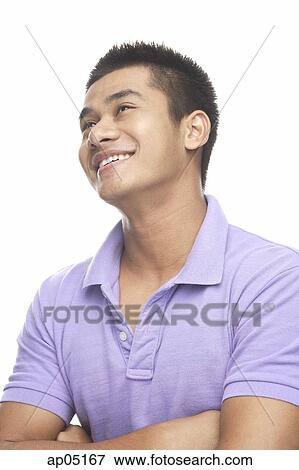 Stock Photo - Man smiling, looking up. Fotosearch