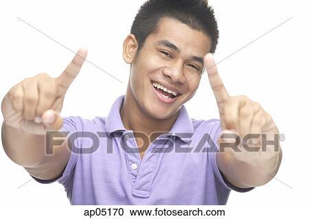 Man smiling, making hand sign View Large Photo Image Stock Image - Man smiling, making hand sign. Fotosearch