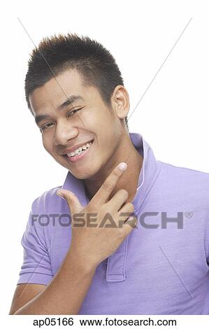 Man smiling, making hand sign View Large Photo Image Stock Photograph - Man smiling, making hand sign. Fotosearch