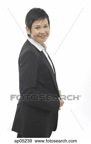 Stock Photo - Mature businesswoman, smiling at camera. Fotosearch