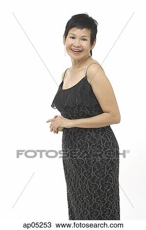 Mature woman in black dress View Large Photo Image Stock Image - Mature woman in black dress. Fotosearch