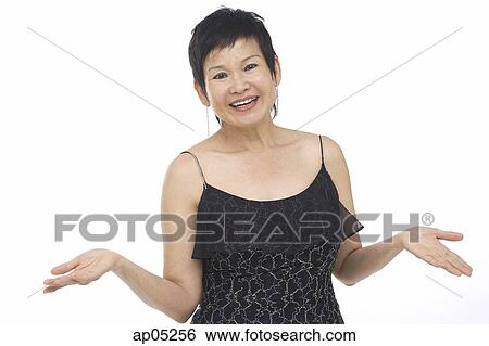Mature woman in black sleeveless top, smiling at camera View Large Photo Image Stock Photograph - Mature woman in black sleeveless top, smiling at camera. Fotosearch