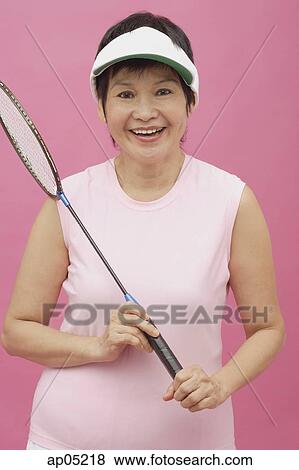 Stock Photo - Mature woman with badminton racket. Fotosearch