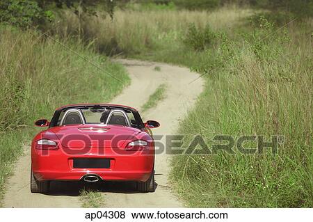 Red Porsche sports car on rural road View Large Photo Image Stock Photo - Red Porsche sports car on rural road. Fotosearch