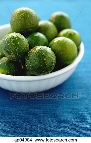 Picture - Still life of bowl of limes. Fotosearch