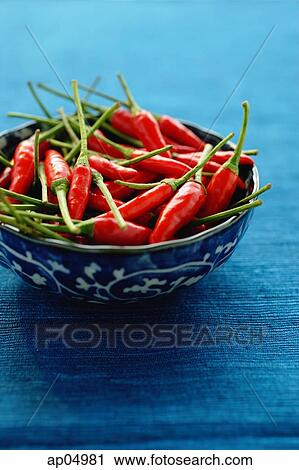Still life of chilies in bowl on blue mat View Large Photo Image Stock Image - Still life of chilies in bowl on blue mat. Fotosearch
