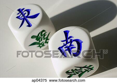 Still life of Chinese dice with the words 'East' and 'South' View Large Photo Image Stock Photography - Still life of Chinese dice with the words 'East' and 'South'. Fotosearch