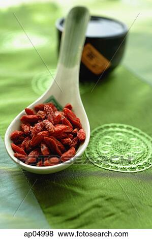 Still life of dried fruit in ceramic spoon and Chinese tea cup View Large Photo Image Stock Photo - Still life of dried fruit in ceramic spoon and Chinese tea cup. Fotosearch