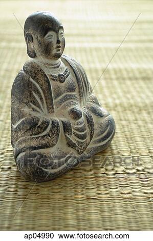 Still life of with small Buddha sculpture on mat View Large Photo Image Stock Image - Still life of with small Buddha sculpture on mat. Fotosearch